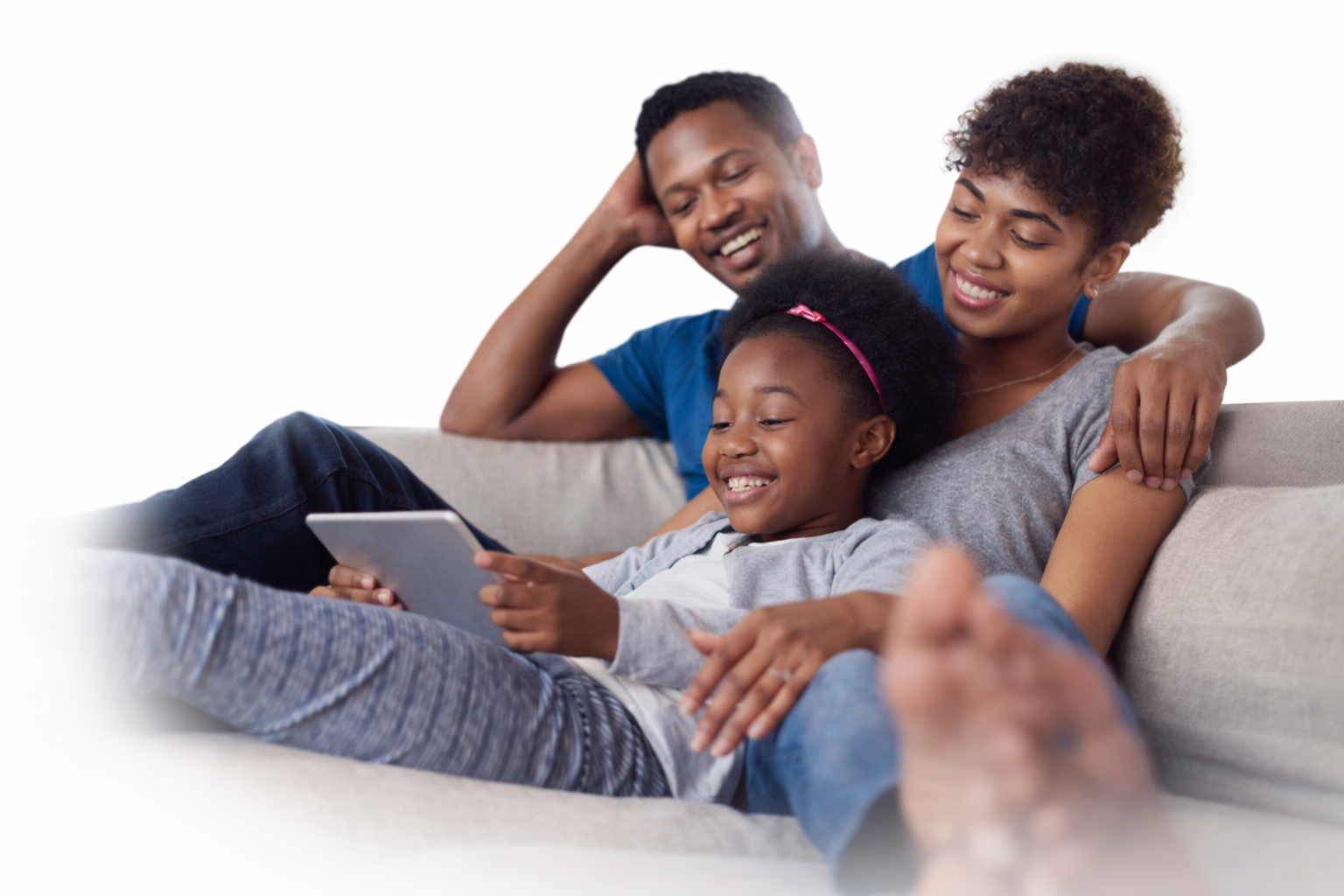 Family using a tablet together at home.