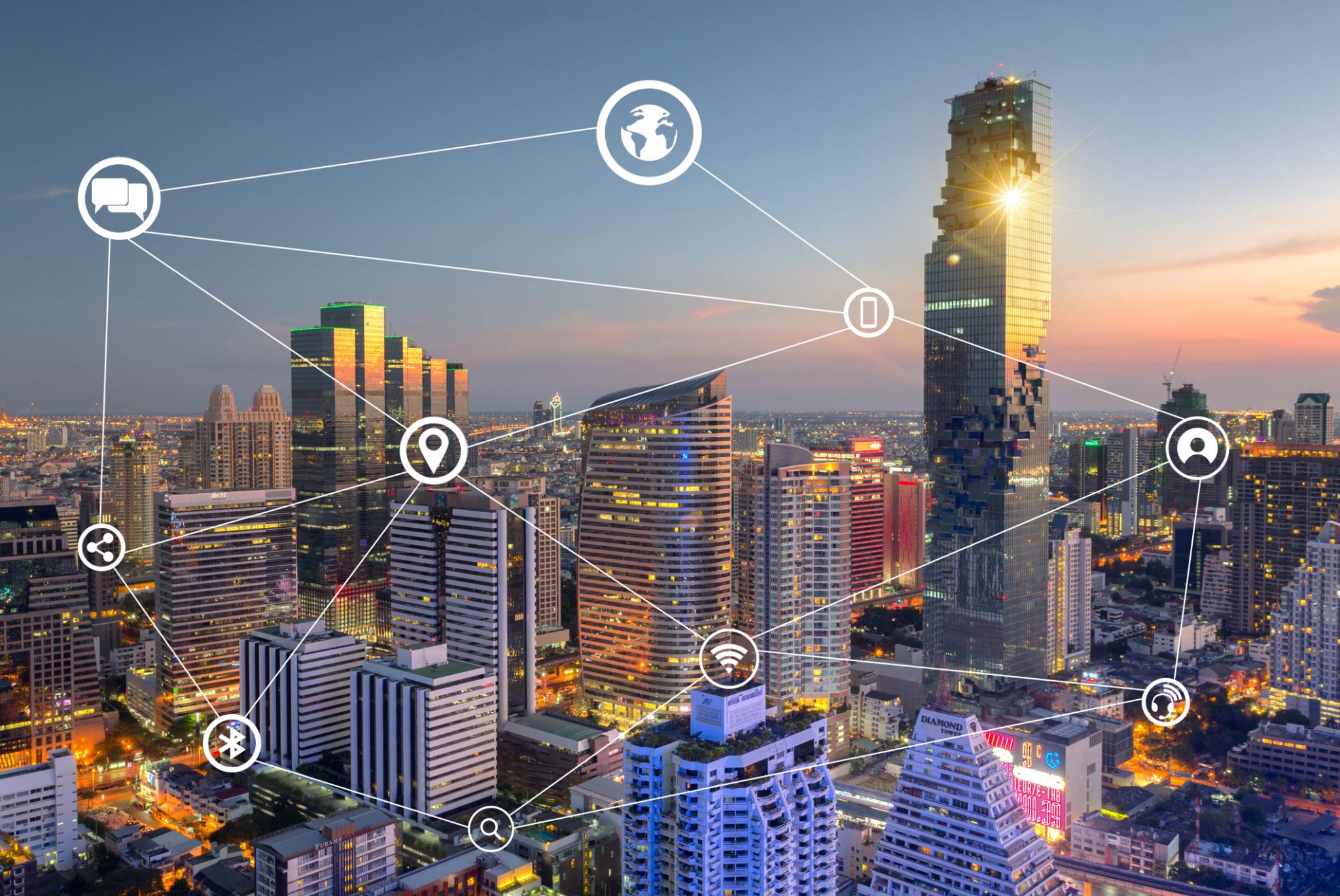 Person holding a phone while streaming content at home.